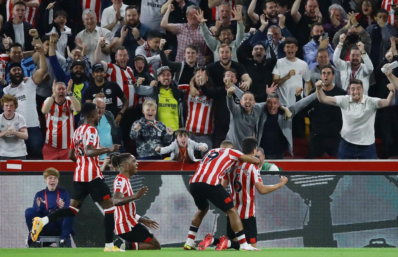 Brentford fans are ecstatic after Christian Norgaard (No. 6) scores the second goal in their 2-0 win over Arsenal in Friday's Premier League game.