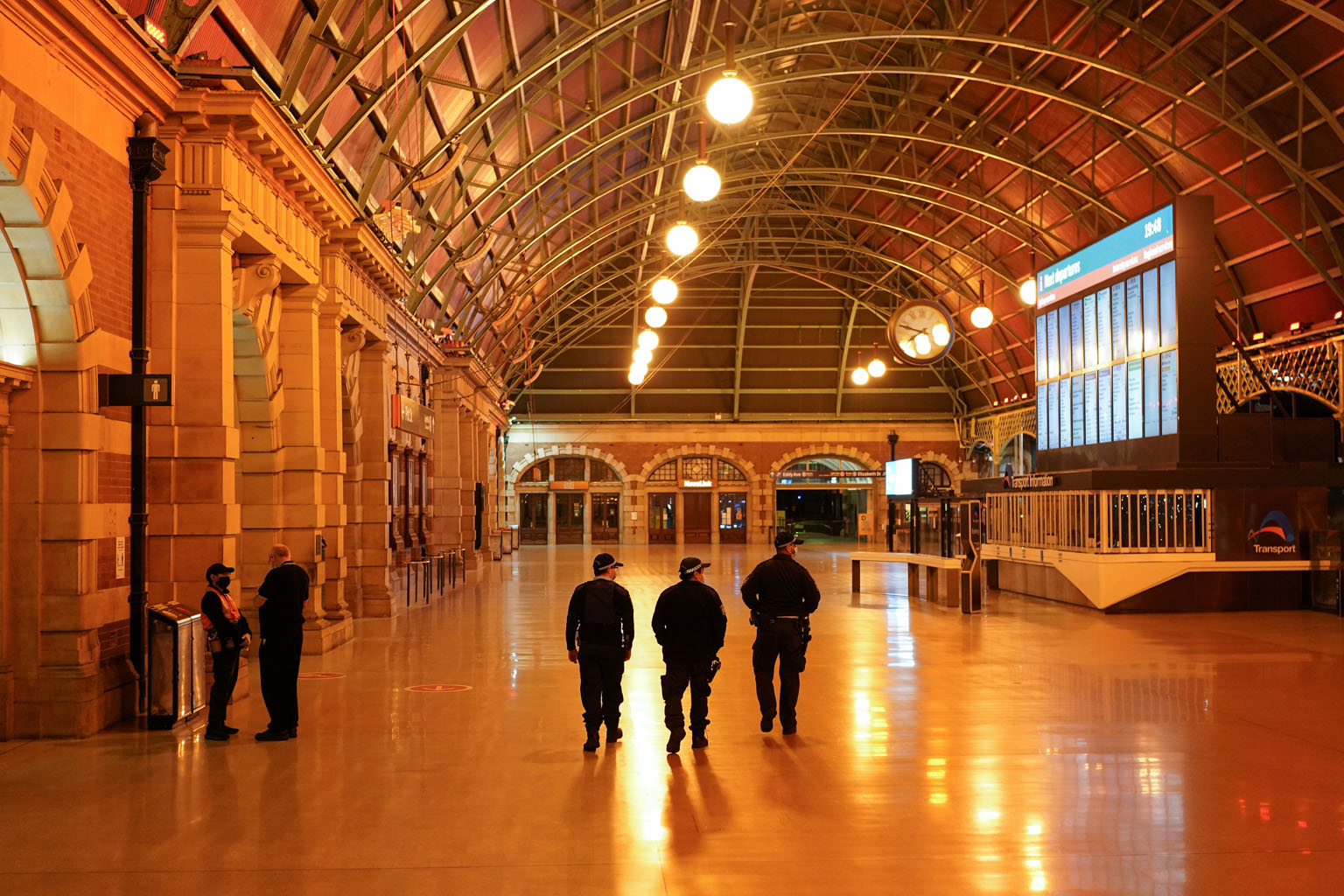 Police officers patrolling the Central Station during the lockdown in Sydney, Australia, last Thursday. As Covid-19 cases surge, it is becoming increasingly unlikely that Sydney will end its nine-week lockdown on Aug 28 as planned. Strict stay-at-hom
