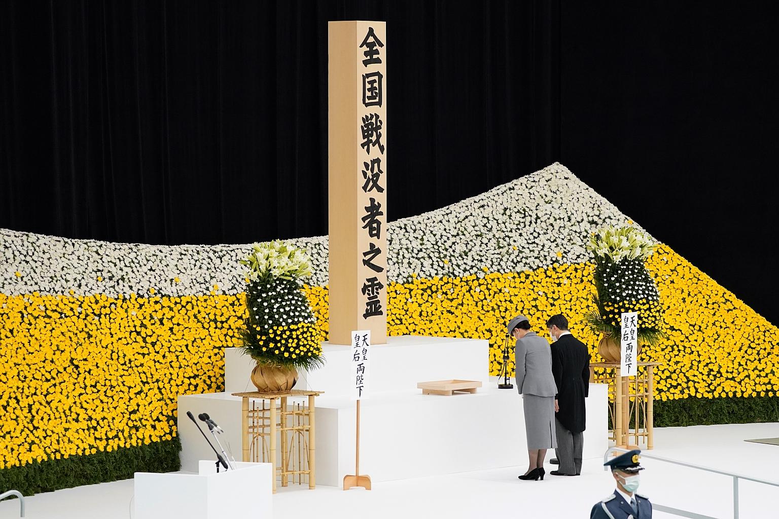 Japan's Emperor Naruhito and Empress Masako observing a moment of silence during a memorial service marking the 76th anniversary of the end of World War II in Tokyo yesterday. Nearly eight decades since the end of the war, the conflict remains a sour