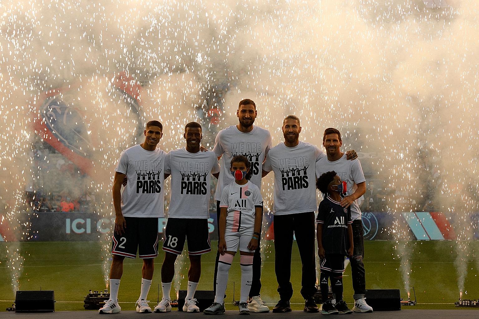 From left: New PSG signings Achraf Hakimi, Georginio Wijnaldum, Gianluigi Donnarumma, Sergio Ramos and Lionel Messi during the presentation at the Parc des Princes before the match against Strasbourg.