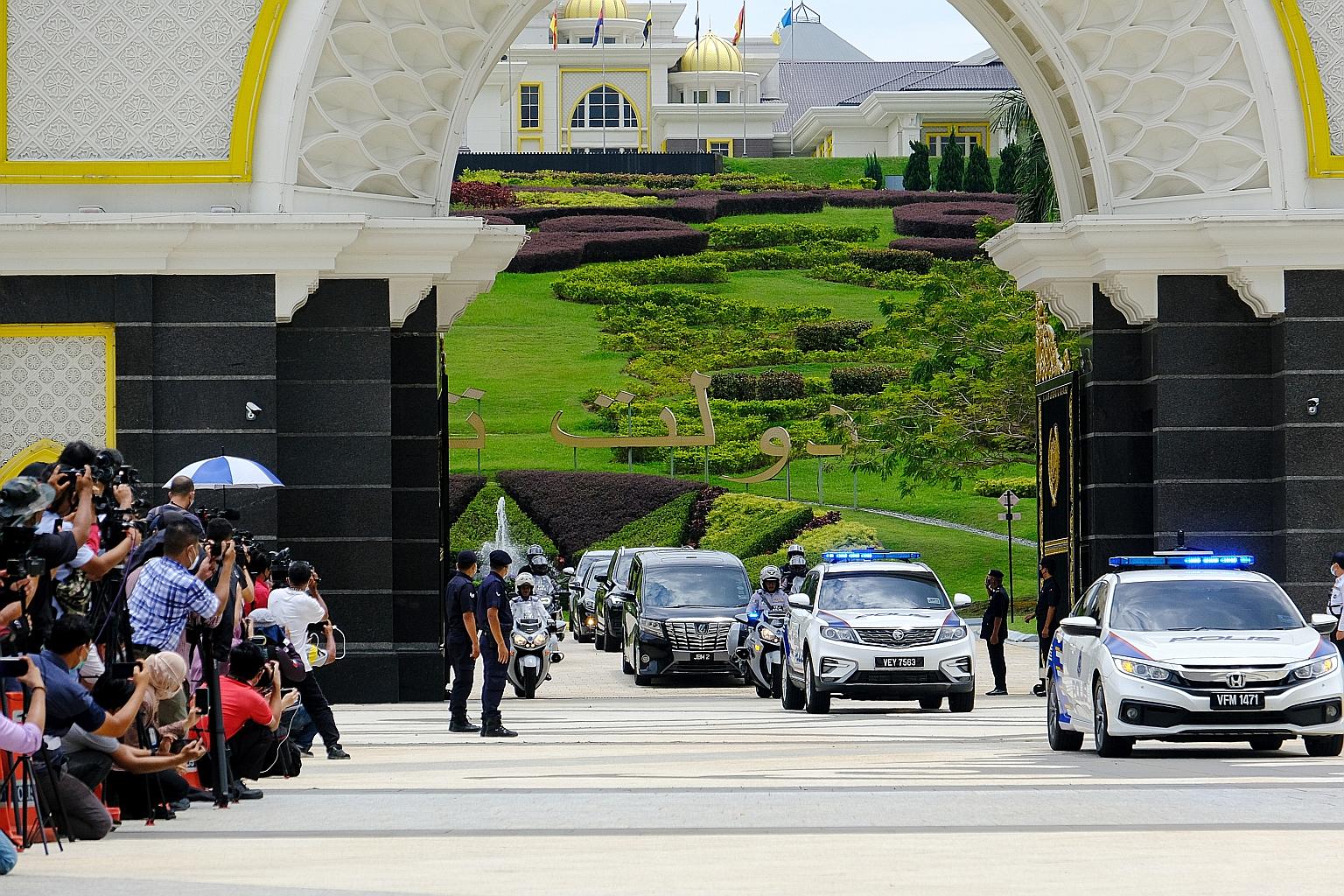Outgoing prime minister Muhyiddin Yassin leaving Istana Negara in Kuala Lumpur yesterday after meeting the King. On social media, some welcomed Tan Sri Muhyiddin's resignation as "punishment" for the "coup" that led to his appointment 18 months ago, 