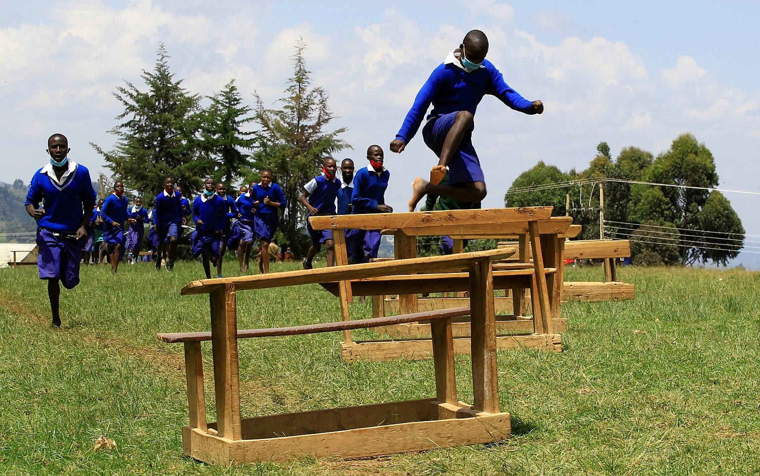 Pupils at Chesubet Primary School taking part in a steeplechase exercise at the school's field in Elgeyo Marakwet county in Kenya. Runners from the county have won the bulk of Kenya's nine Olympic golds in men's steeplechase. PHOTO: REUTERS
