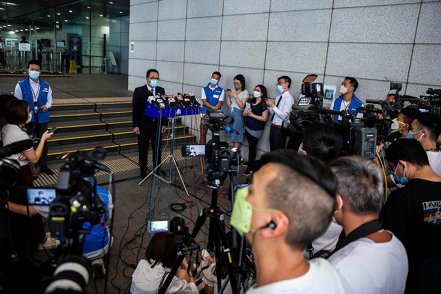 Senior Superintendent Steve Li told the media yesterday that the students were detained under the national security law for advocating terrorism, over a motion to pay tribute to a man who stabbed a police officer last month. PHOTO: AGENCE FRANCE-PRES