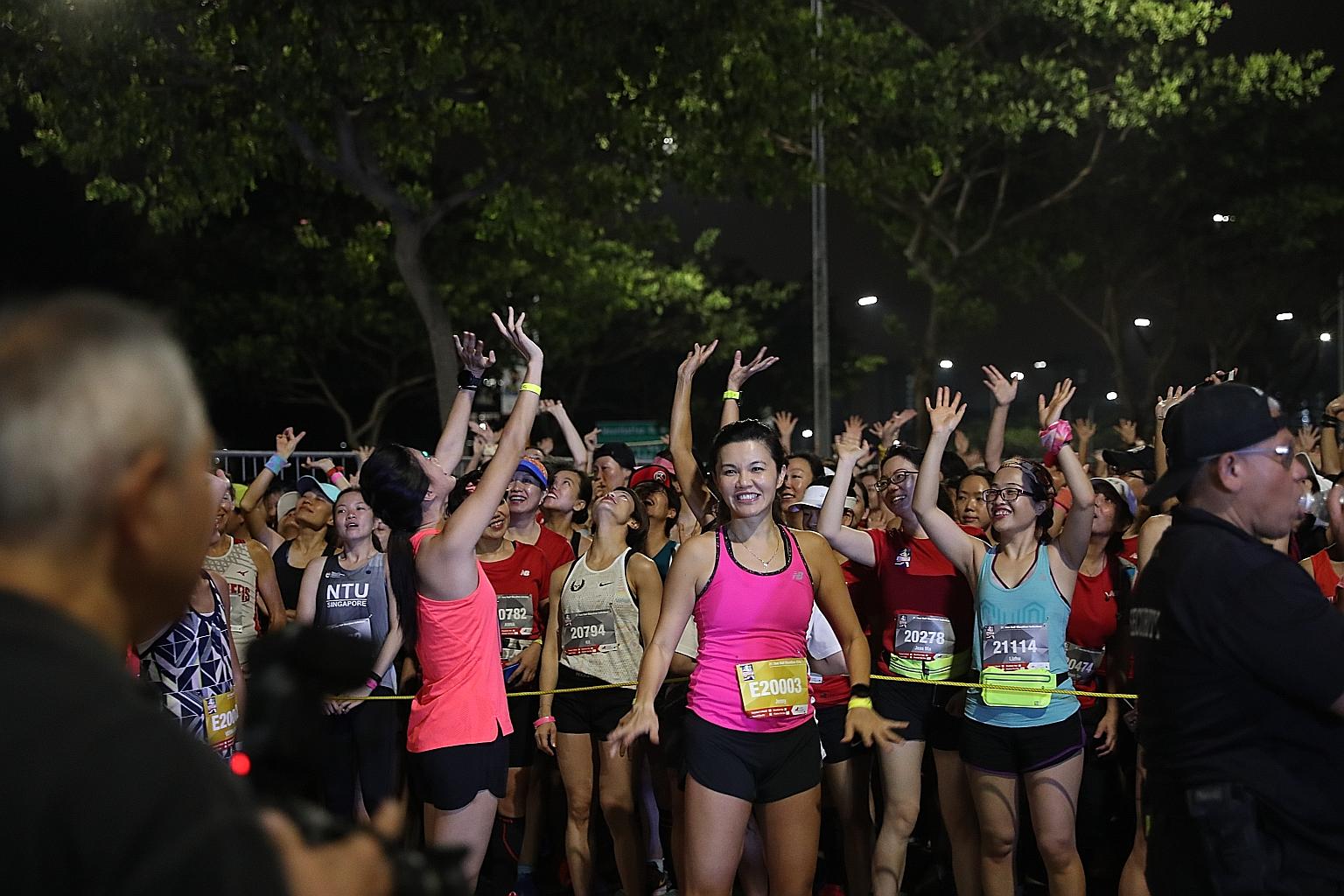 Participants waving to a drone as they gather for flag off during the 2019 Great Eastern Women's Run. The event, which drew close to 13,000 runners, did not take place last year owing to the Covid-19 pandemic.