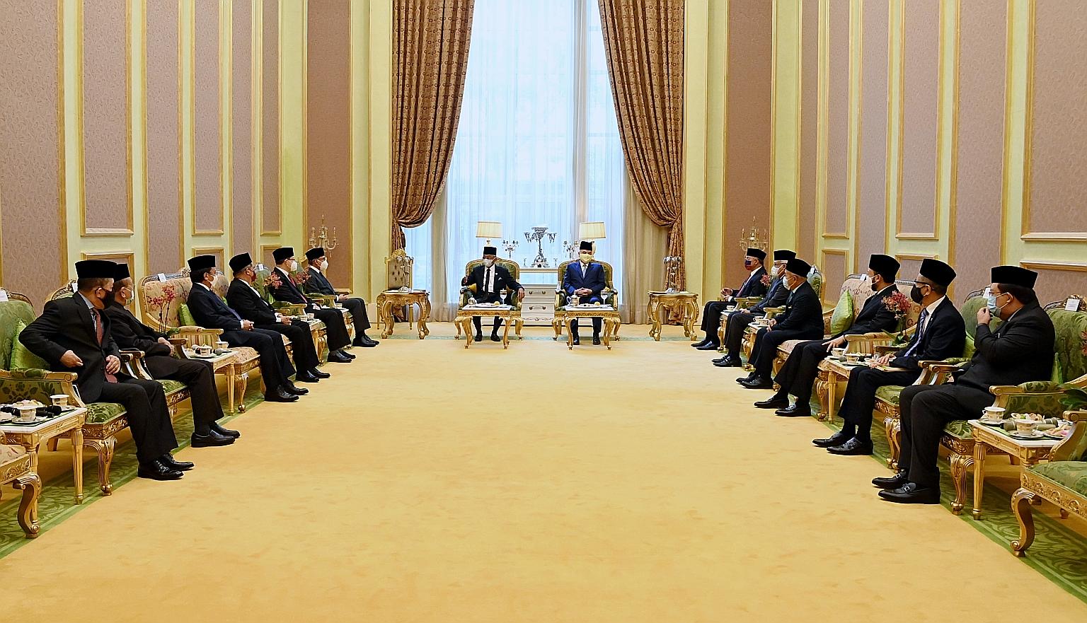 Malaysia's King, Sultan Abdullah Ahmad Shah (centre, left), and his deputy, Sultan Nazrin Shah of Perak, at a joint audience on Tuesday with key party leaders. Yesterday, the country's 220 lawmakers submitted to the palace their choice of candidate t