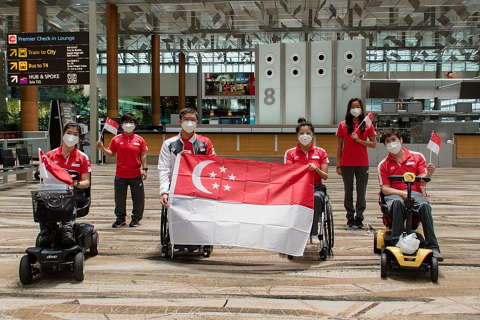 (From left) Singapore's para-athletes Gemma Foo (equestrian), Nur Aini Mohamad Yasli (powerlifting), Toh Wei Soong, Yip Pin Xiu and Sophie Soon (swimming), and Maximillian Tan (equestrian) at Changi Airport before departing for the Tokyo Paralympic G