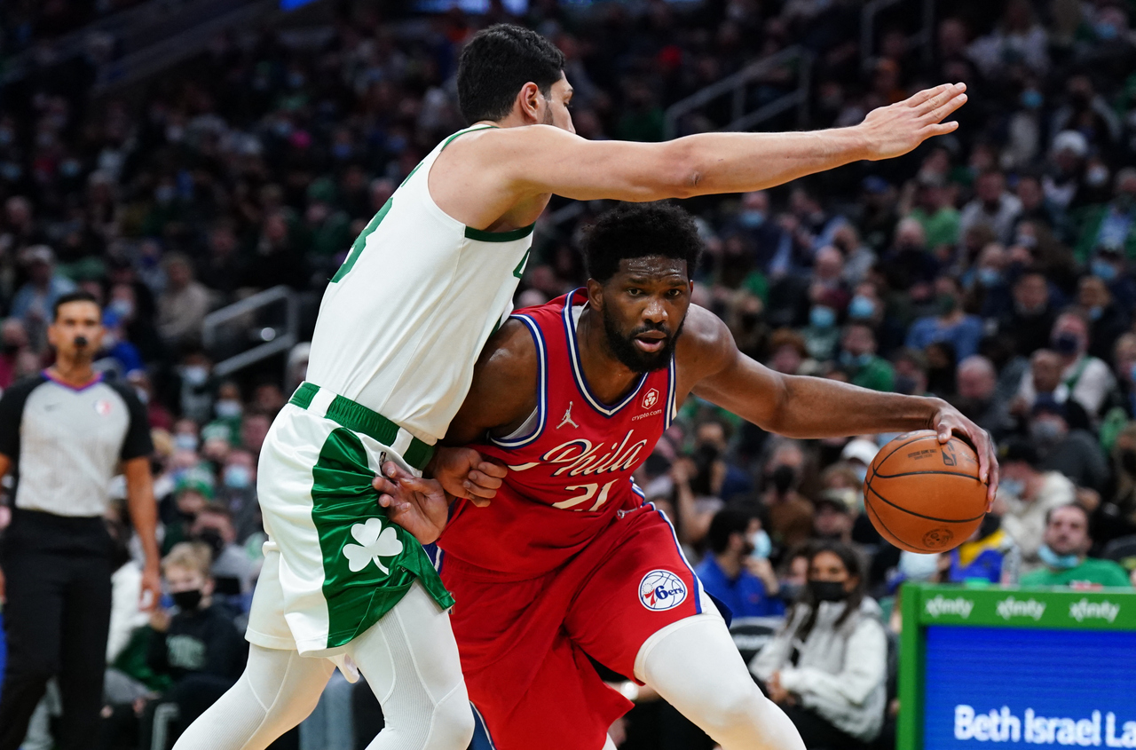 <p>Dec 20, 2021; Boston, Massachusetts, USA; Philadelphia 76ers center Joel Embiid (21) drives the ball against Boston Celtics center Enes Freedom (13) in the second quarter at TD Garden. Mandatory Credit: David Butler II-USA TODAY Sports</p>