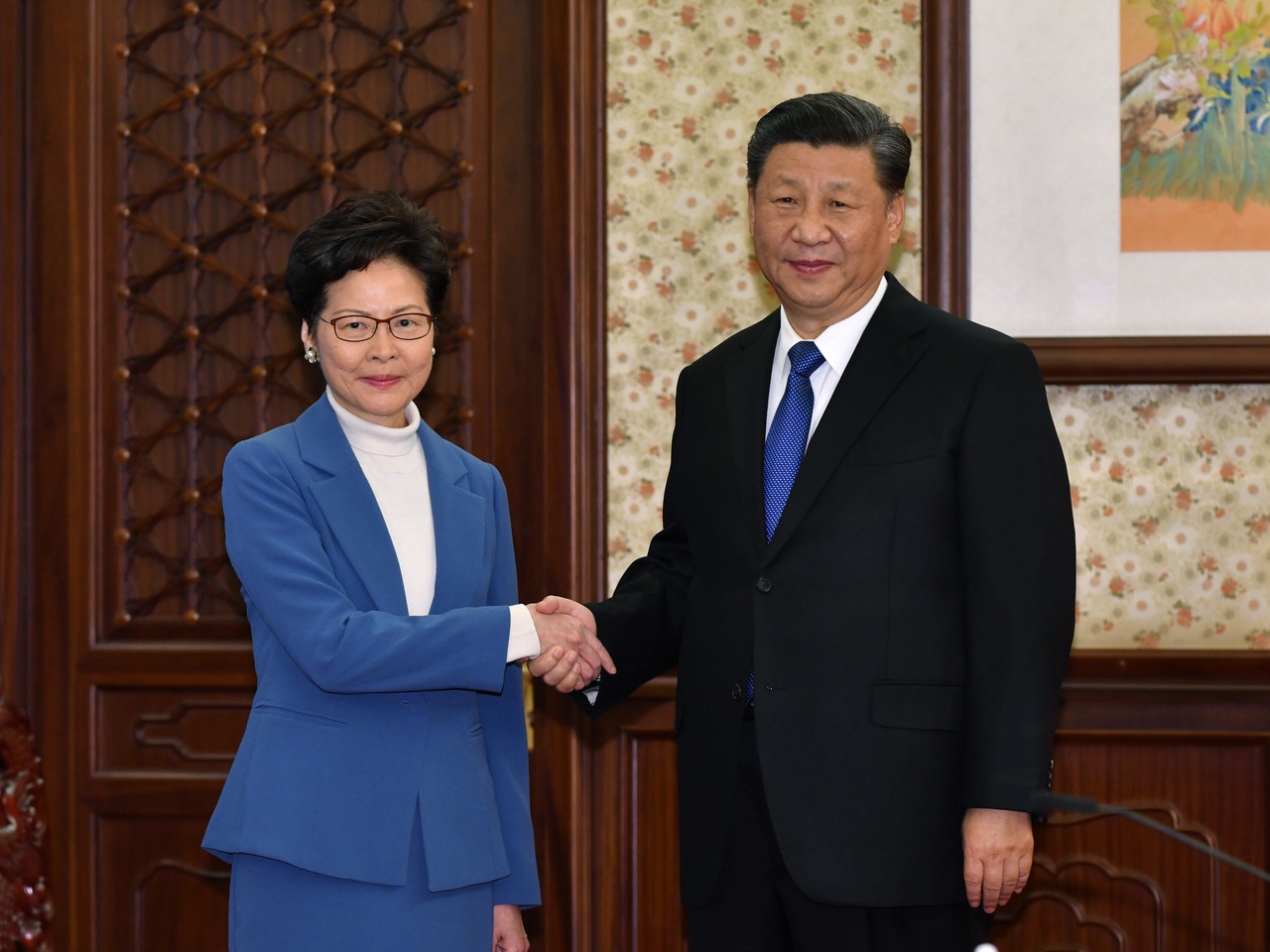 <p>In this photo provided by Hong Kong Government Information ServicesChinese President Xi Jinping, right, shakes hands with Hong Kong Chief Executive Carrie Lam in Beijing, China, Monday, Dec. 16, 2019. Chinese President Xi Jinping has said Hong Kong has