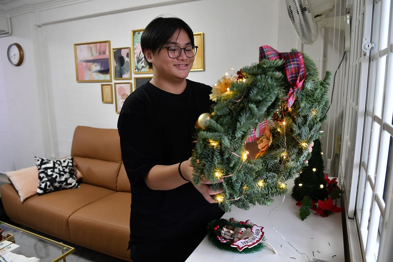 Jessel Ng, 17, puts up Christmas decoration in his newly renovated HDB flat on December 21, 2021I am working on a story for Christmas (Dec 25) pub about a low-income family who received help from Heart of God church to renovate his home. The story wi