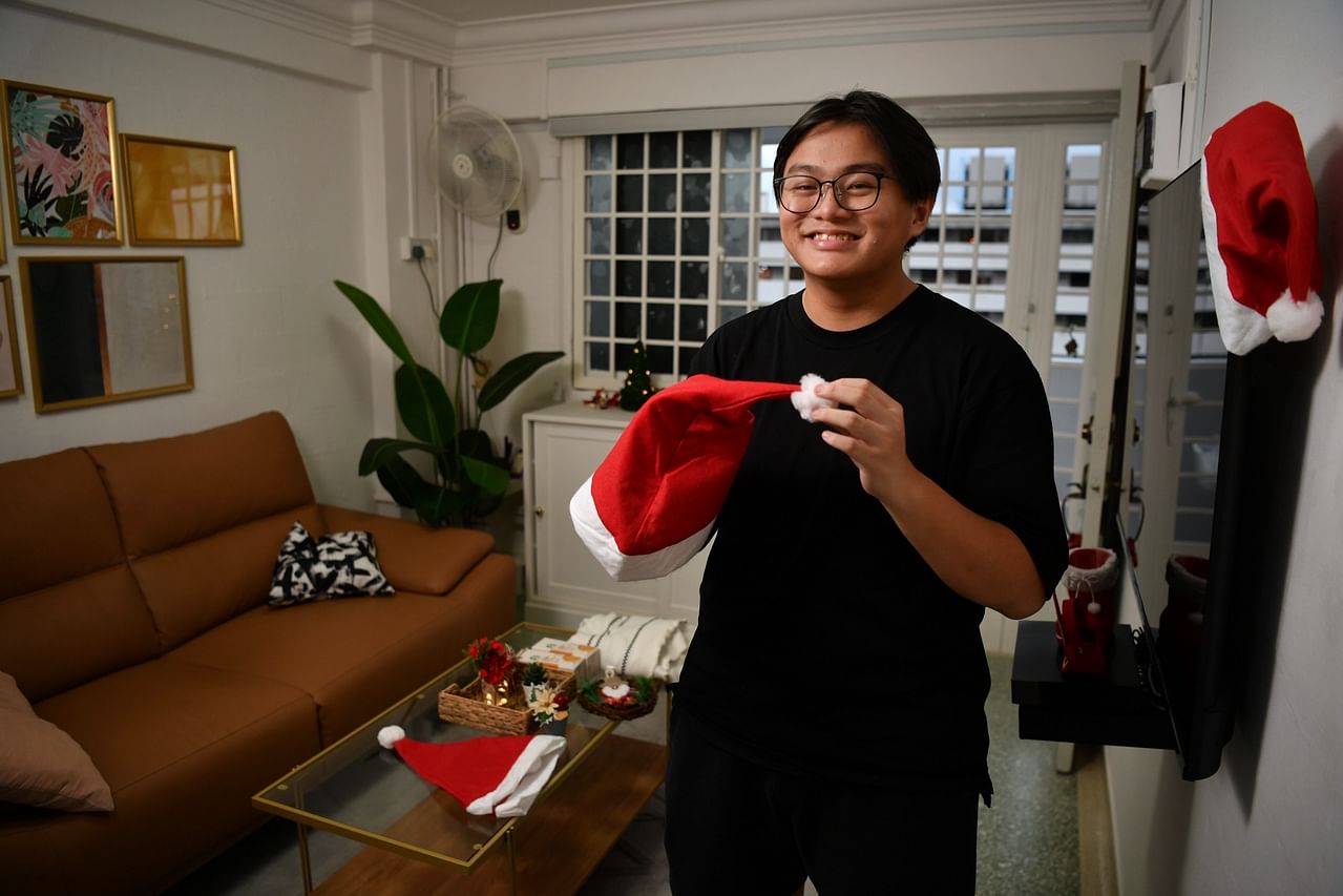 Jessel Ng, 17, puts up Christmas decoration in his newly renovated HDB flat on December 21, 2021I am working on a story for Christmas (Dec 25) pub about a low-income family who received help from Heart of God church to renovate his home. The story w
