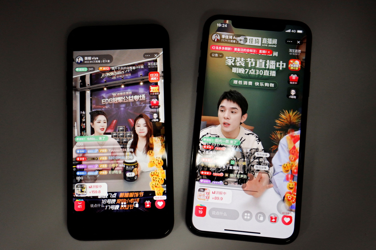 <p>Livestreaming sessions by Chinese livestreamers Li Jiaqi and Viya, whose real name is Huang Wei, (L) are seen on Alibaba's e-commerce app Taobao displayed on mobile phones in this illustration picture taken December 14, 2021. Picture taken December 14,