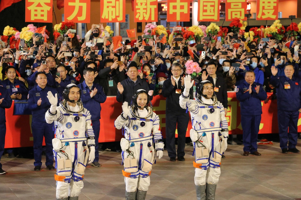 <p>Astronauts (fromL) Ye Guangfu, Wang Yaping and Zhai Zhigang, the second crew for China's new space station, wave at a departure ceremony before their launch on the Shenzhou 13 spacecraft, at the Jiuquan Satellite Launch Centre in the Gobi desert, in no