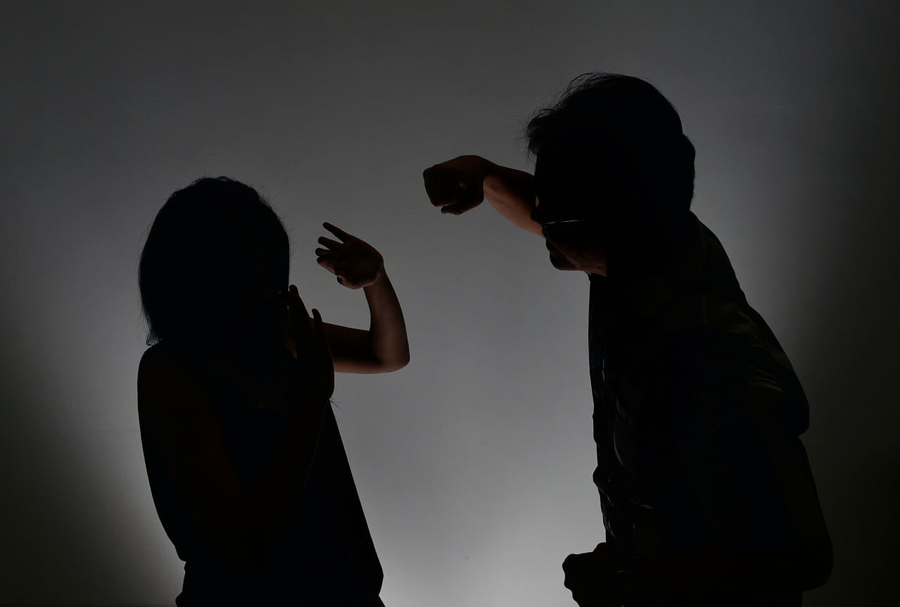 Posed photo of a couple in an abusive relationship.
