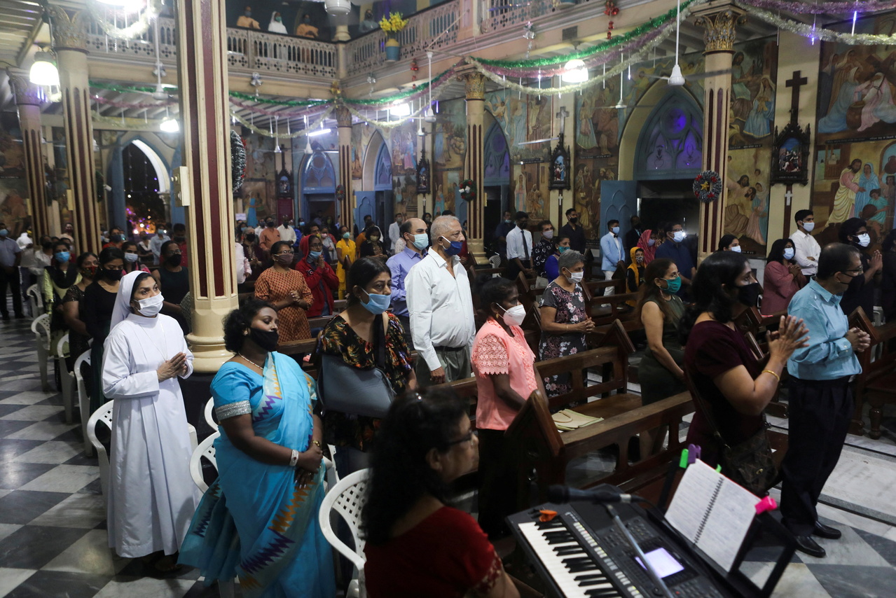 In a photo from Dec 24, 2020, Christians attend mass in Mumbai.