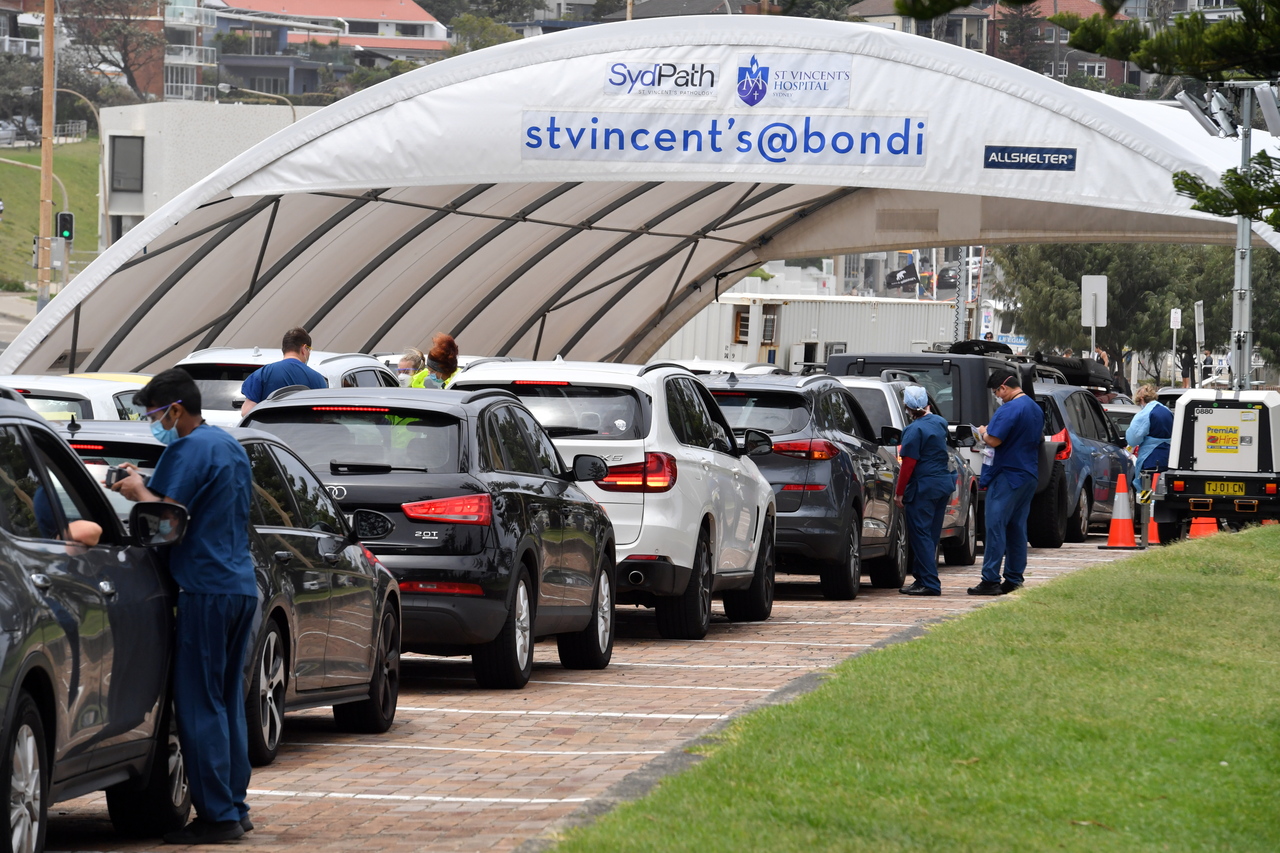 People lining up for Covid-19 tests at a clinic at Bondi Beach in Sydney on Dec 27, 2021.