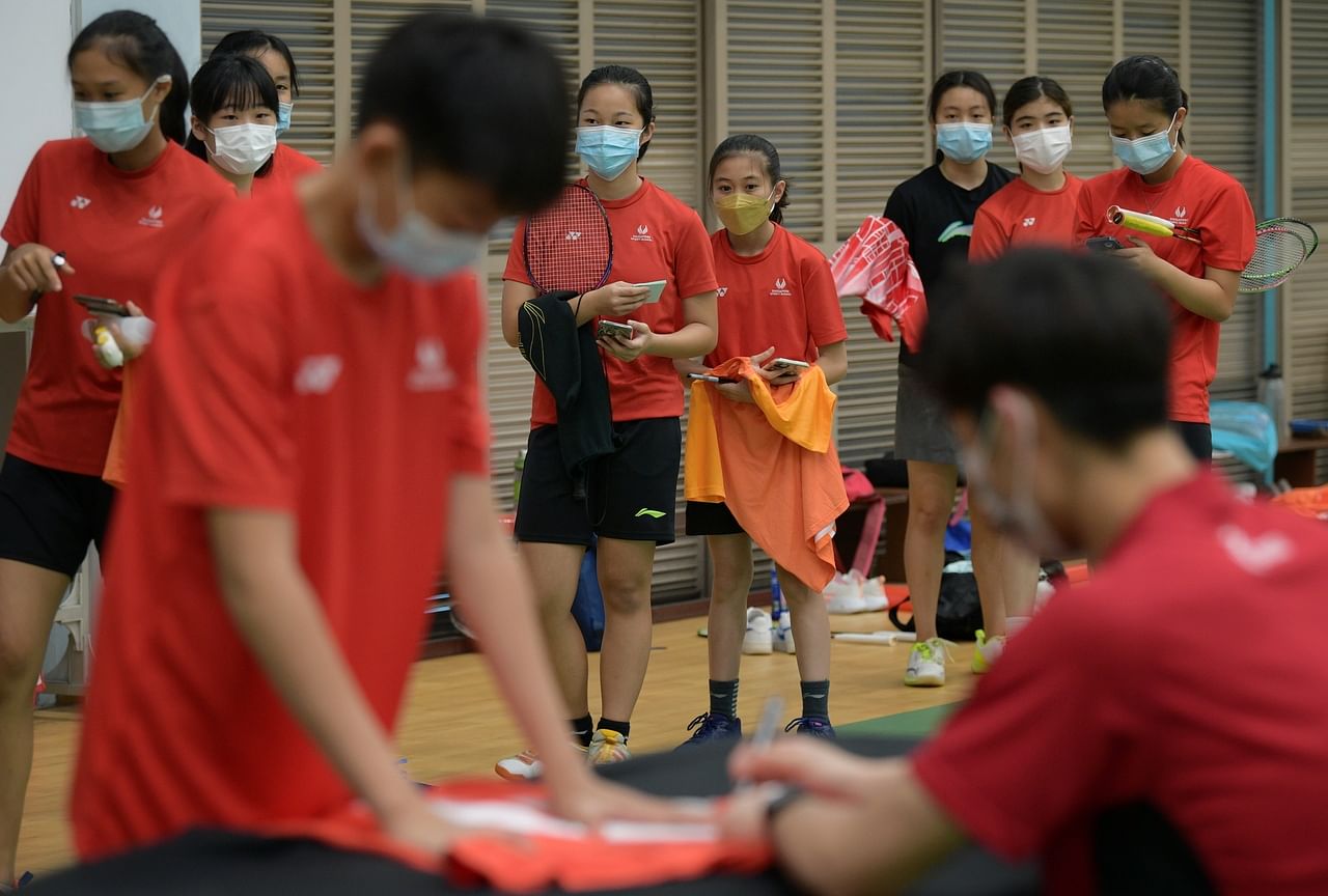 Junior badminton players at the Singapore Sports School getting paraphernalia ready for an autograph session with badminton world champion Loh Kean Yew.

Singapore Sports School will be organising the Homecoming of A World Champion - Loh Kean Yew to celeb
