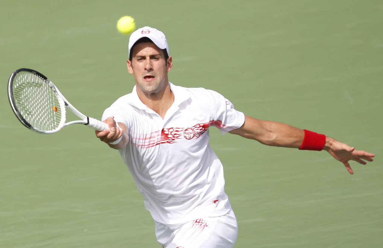 <p>Novak Djokovic of Serbia returns a shot against Mikhail Youzhny of Russia during the final at the ATP Dubai Tennis Championships, February 28, 2010. REUTERS/Mosab Omar (UNITED ARAB EMIRATES - Tags: SPORT TENNIS)</p>