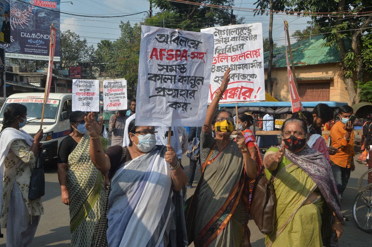 <p>Supporters of Socialist Unity Centre of India (SUCI) shout anti government slogans as they protest over the killing of 14 civilians by Indian security forces in Nagaland days before, in Siliguri on December 8, 2021. (Photo by Diptendu DUTTA / AFP)</p>