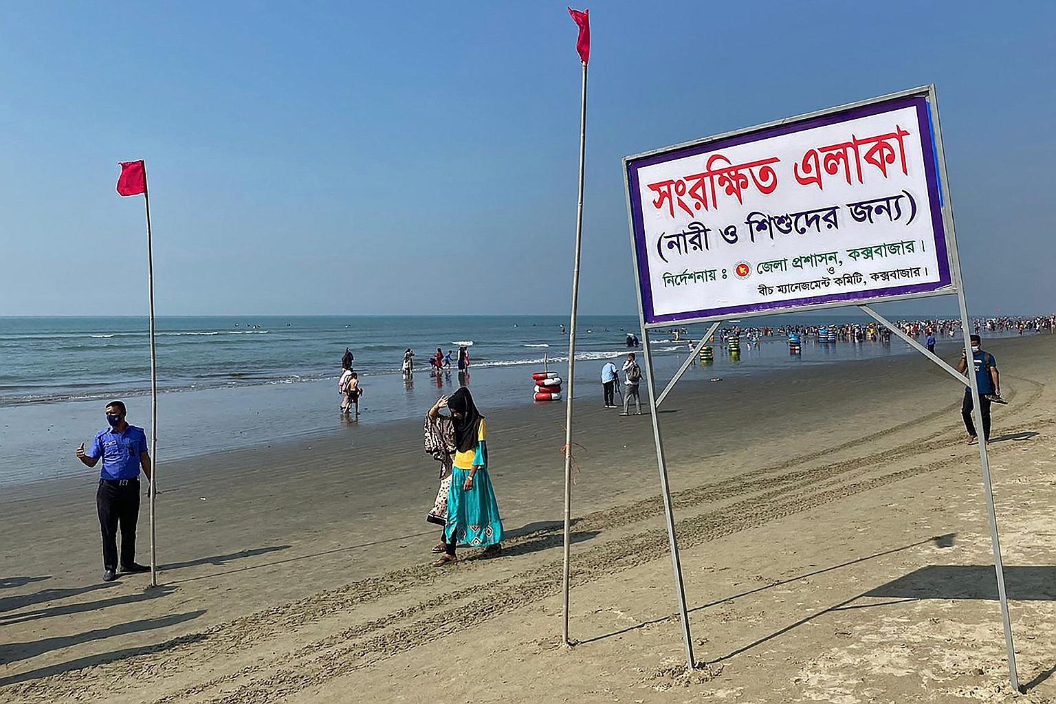 A signboard that reads "Reserved area for women and children as instructed by the district commissioner" at the beach in Cox's Bazar on Wednesday.
