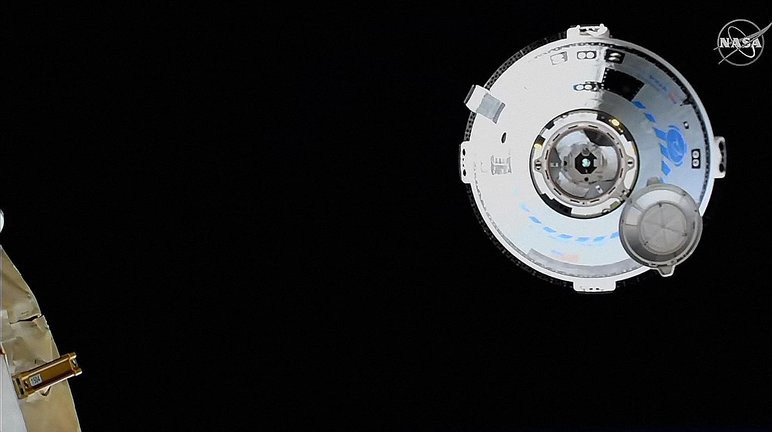 If all goes well with the current mission, the Starliner - seen here approaching the International Space Station - could fly its first team of astronauts to the space station as early as the autumn.