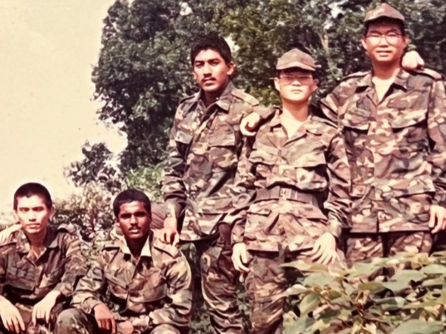 Mr Darryl David (centre) enlisted in 1989 and served in the Artillery and Support Services, among others.
