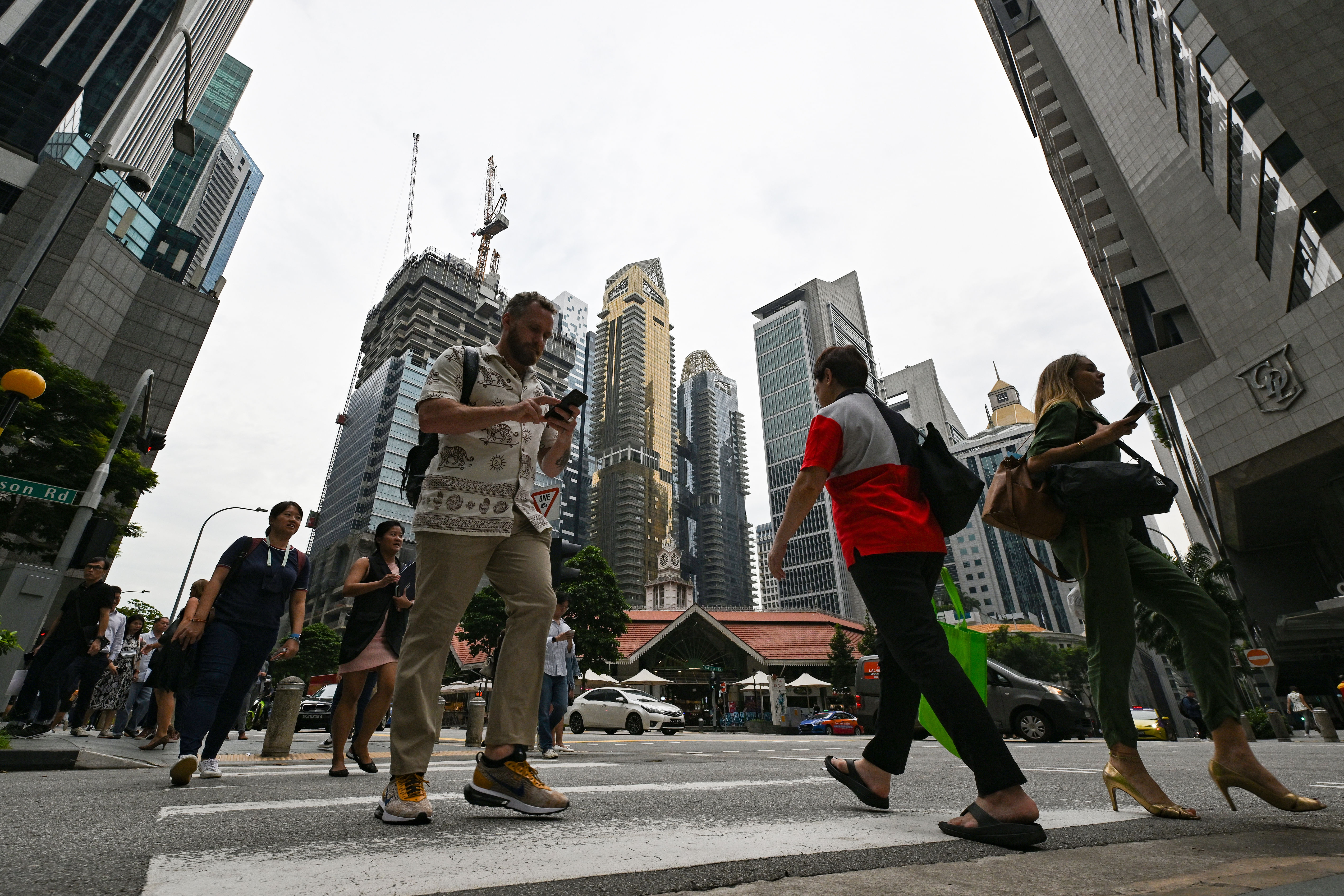 MAS keeps Singdollar policy unchanged anticipating a 'deeper' economic  slowdown