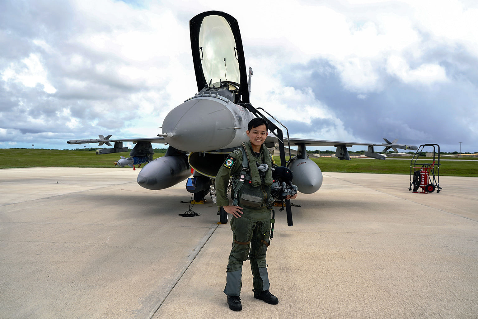 Lieutenant Colonel Jason Lau standing in front of his fighter plane