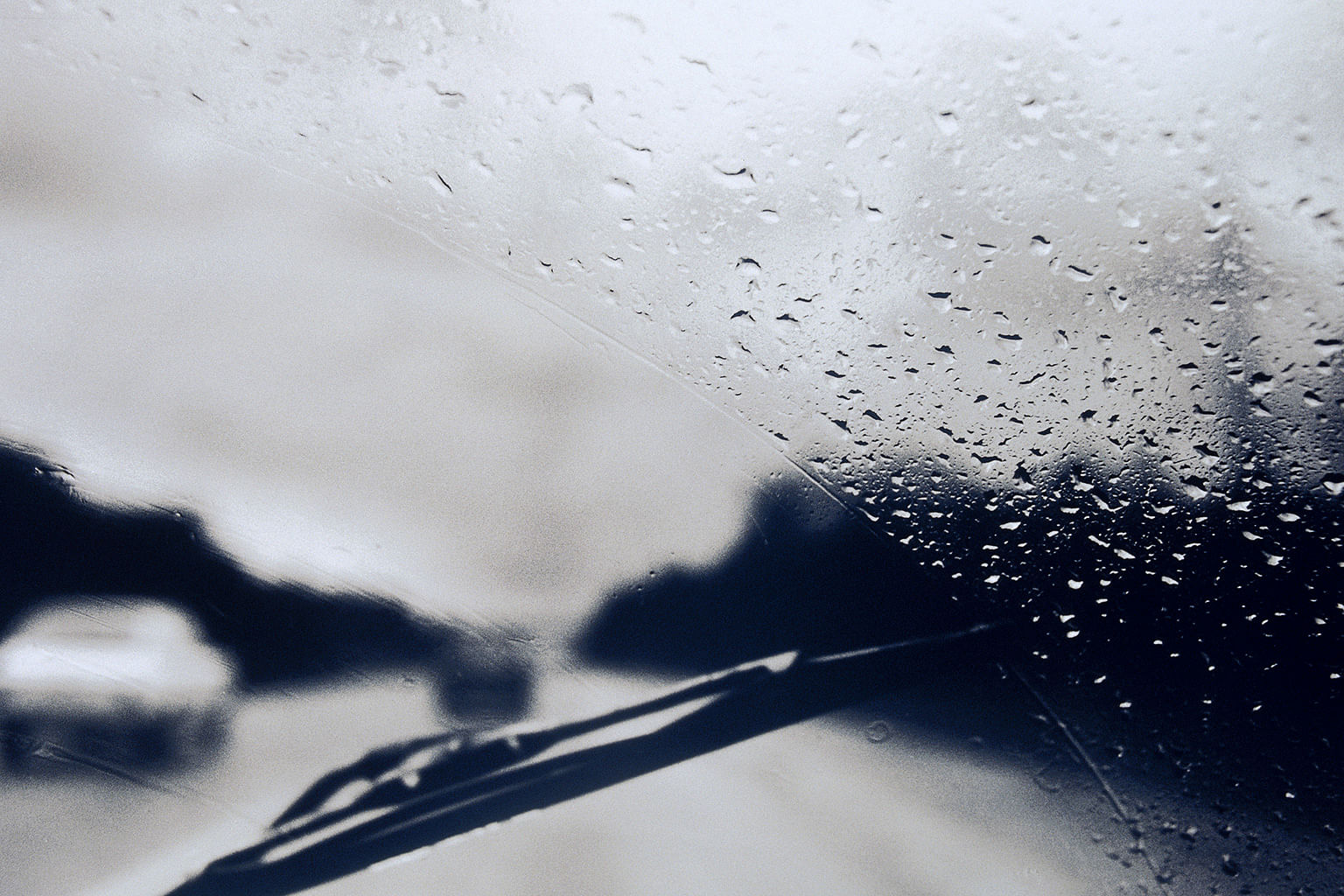 wiper blades activated on car during wet weather condition