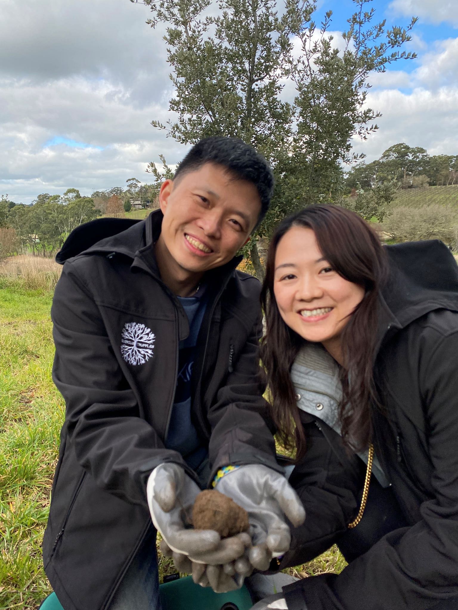 Asian couple truffle hunting at Quercus Truffles, Adelaide Hills, South Australia