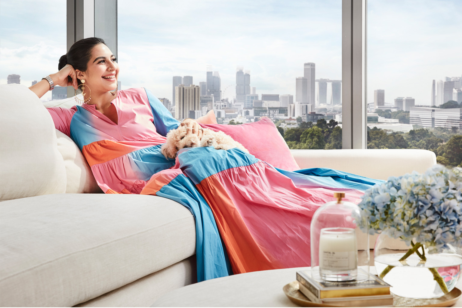 Content creator Marjhan Kausar lounging on her King Living Jasper sofa