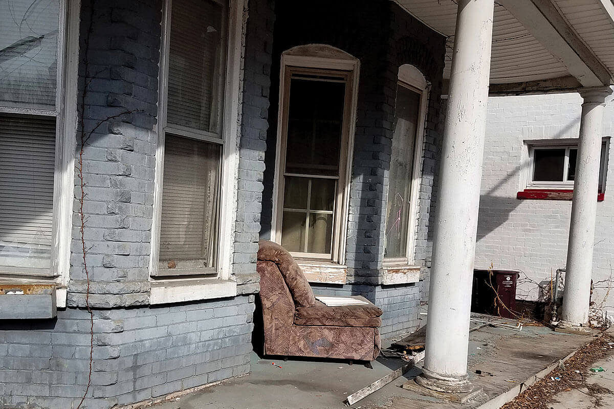 A couch outside a derelict house in Cumberland, Maryland in the US.