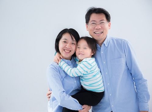 Ms Claire Wang with her daughter, whose nickname was Little Light Bulb, and husband. 