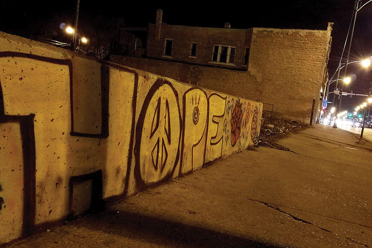 The word ‘hope’ is displayed in graffiti on a wall in South Austin, Chicago.