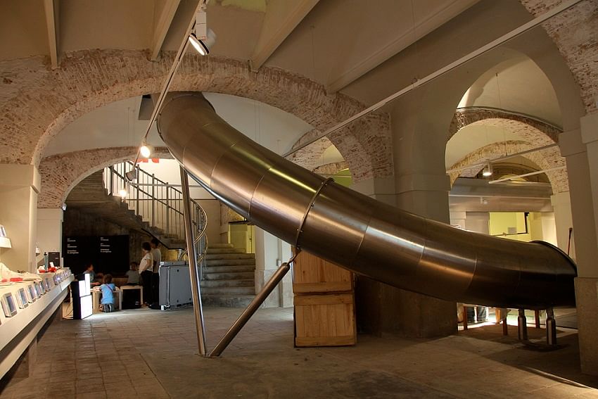 Jump into the enclosed metal slide in the Museum of Ideas and Innovation in Barcelona to get from the ground floor to the basement.