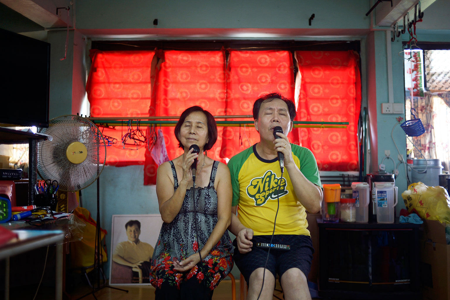 Madam Tian Ying Lee, 62, and her husband Wong Ah Fook, 53. The couple have lived in Dakota Crescent (below) for 21 years and share a love for singing. They have won several singing contests, and often invite their neighbours to join them for karaoke 