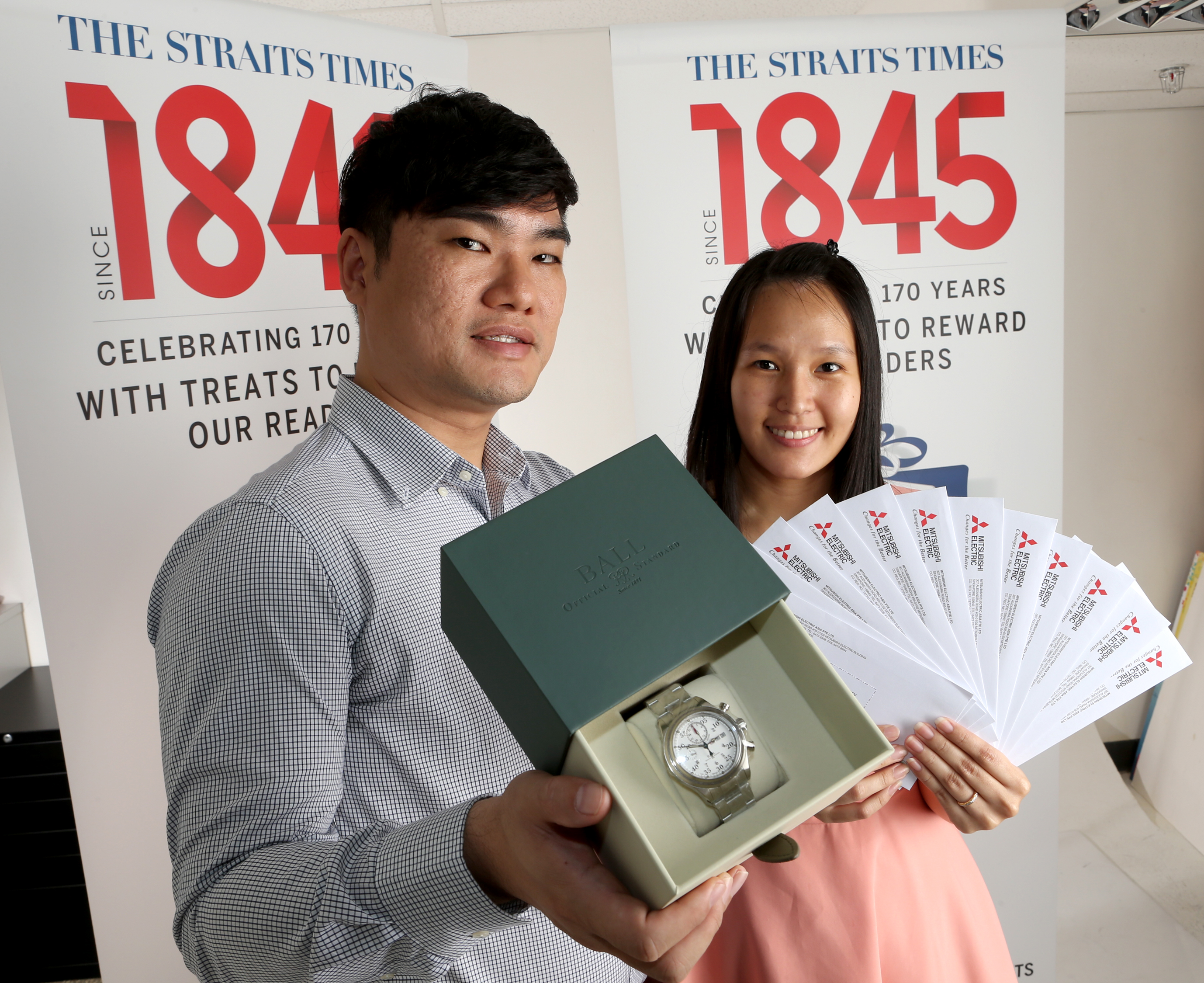 Avid watch collector Jerome Tan won the classic Ball Trainmaster Racer worth $5,050 while Ms Lim Mei Shen walked away with the Mitsubishi Cool Treats package worth $10,000. ST PHOTO: WANG HUI FEN