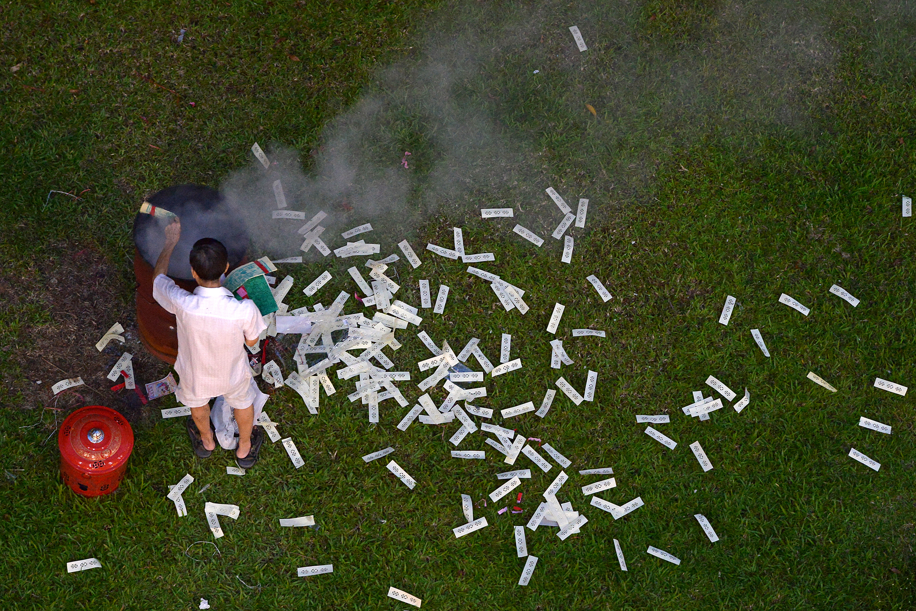 The National Environment Agency advises devotees to clean up after making their offerings and use containers and burning pits.