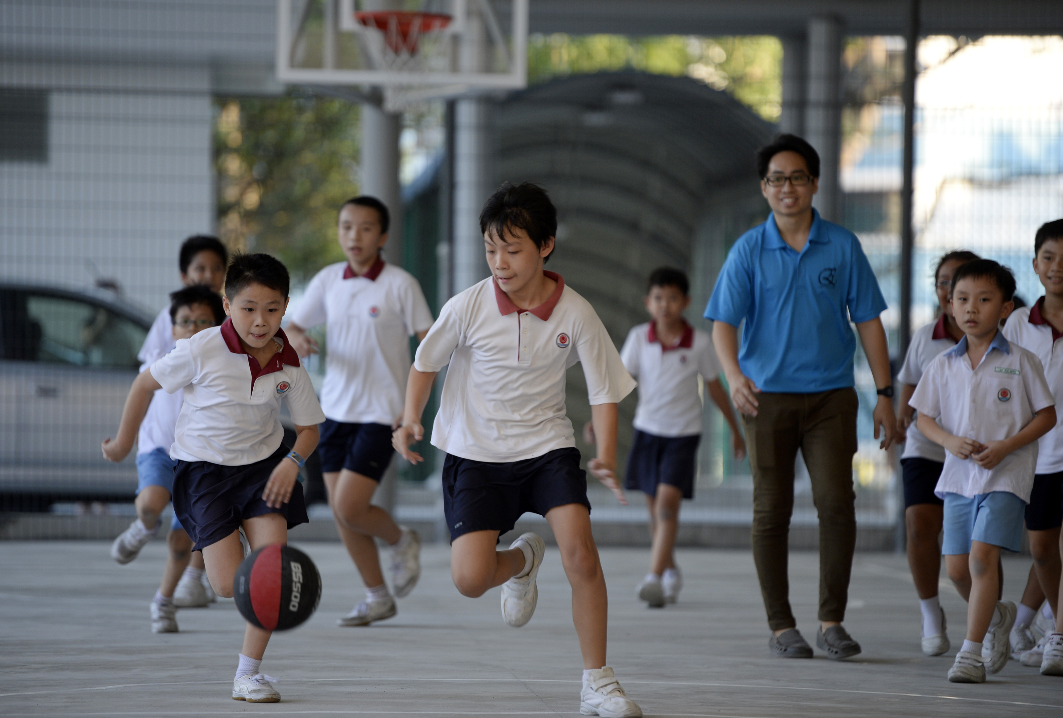 Pupils at Keming Primary School's student care centre engrossed in play. While the number of student care centres has risen 30 per cent in five years, the growth has been mainly in school-based ones.