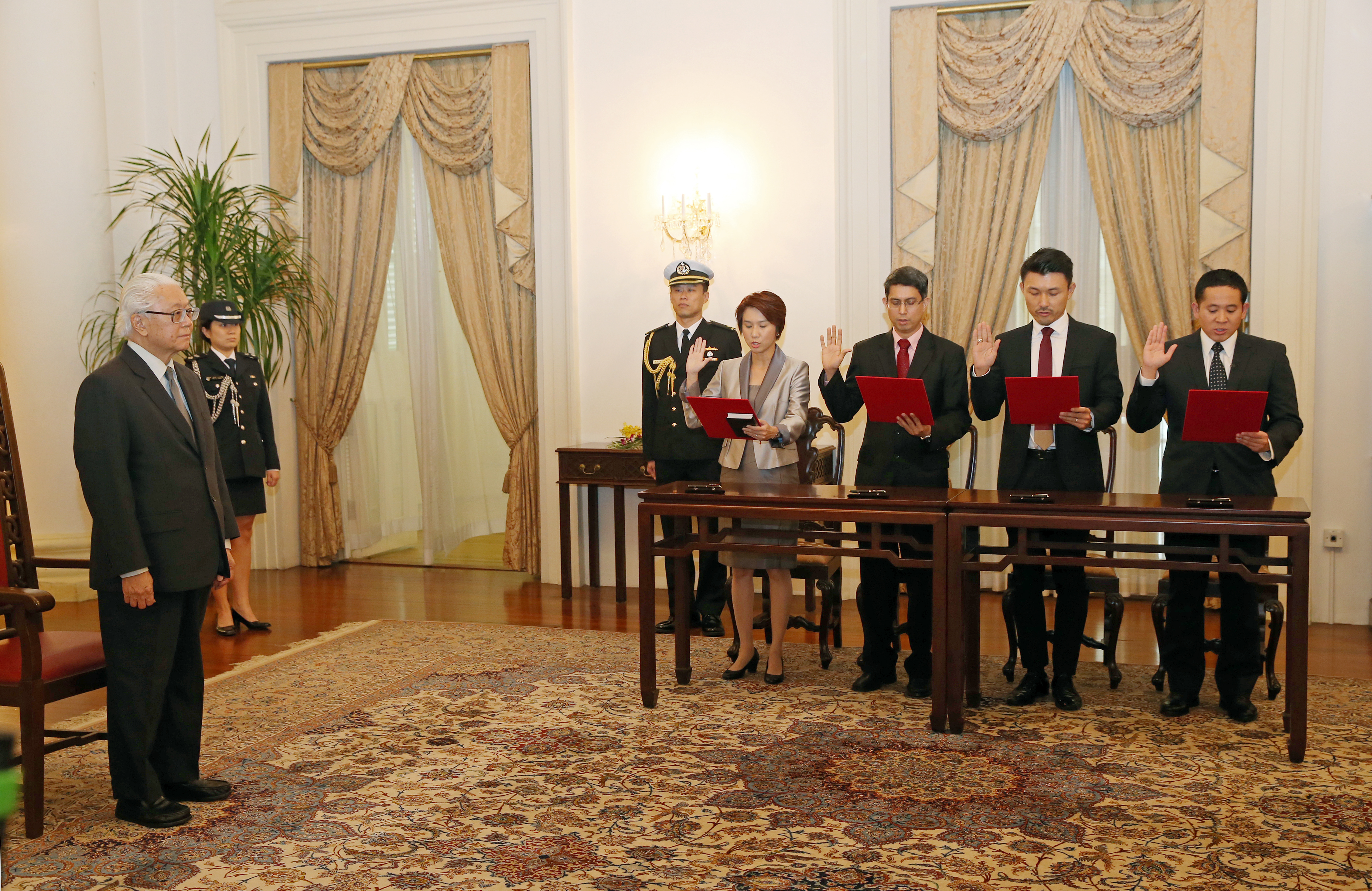 Turning 37 yesterday was memorable for former lawyer Amrin Amin (right) as it coincided with his formal appointment as Parliamentary Secretary for Home Affairs. Taking his oath at an afternoon ceremony officiated by President Tony Tan Keng Yam, the n