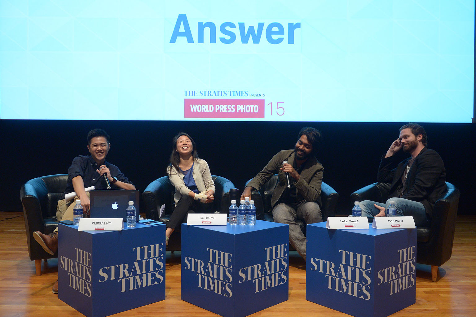 (From left) Moderator Desmond Lim of ST and the photojournalists, Ms Sim, Mr Sarker and Mr Muller, at last night's panel discussion, which was attended by more than 150 members of the public.