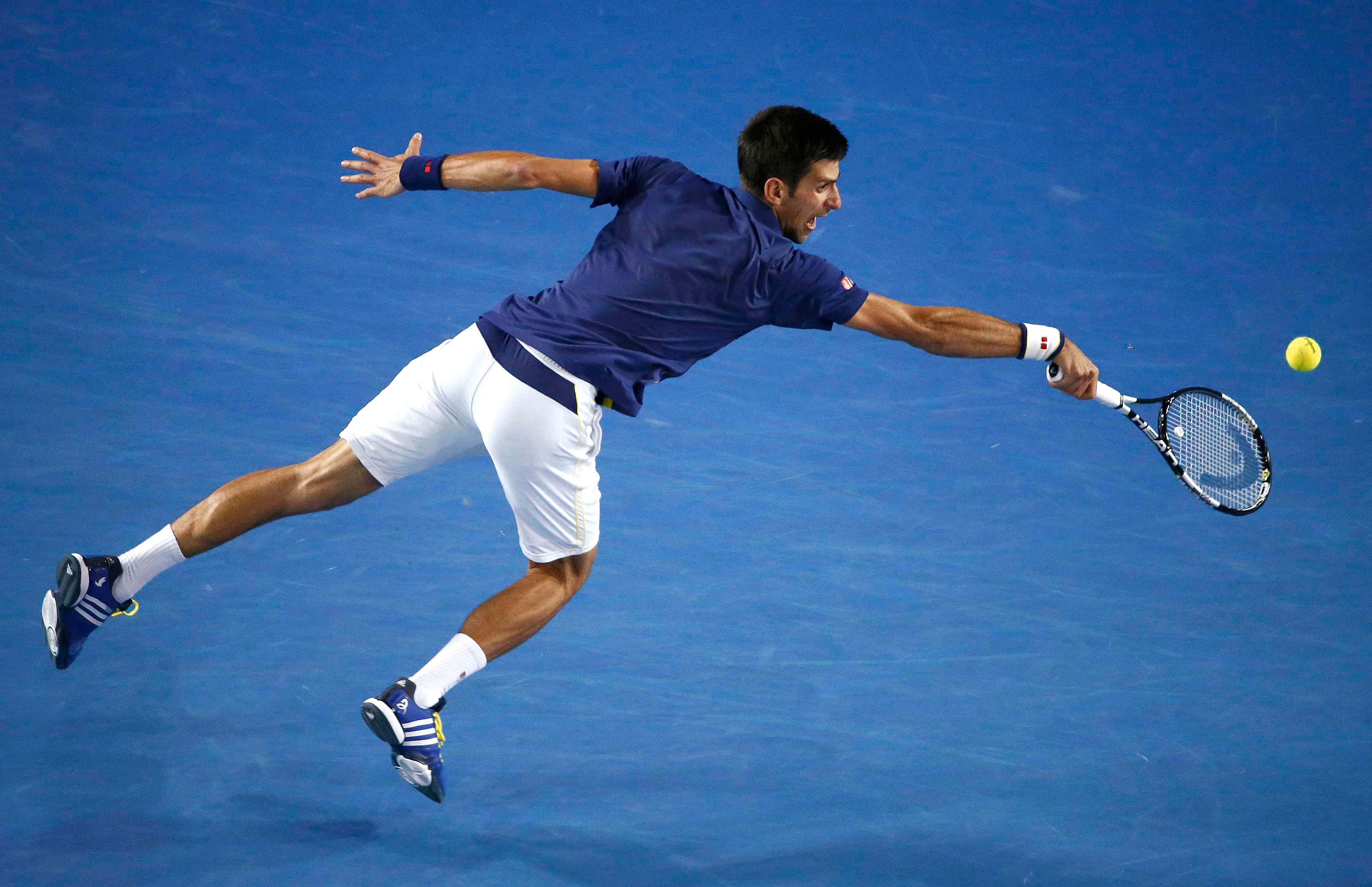 Novak Djokovic stretches for a shot during his 6-1, 7-5, 7-6 (7-3) victory in the Australian Open final against Andy Murray yesterday. The straight-sets victory meant that Murray has lost five times in Australian Open finals.