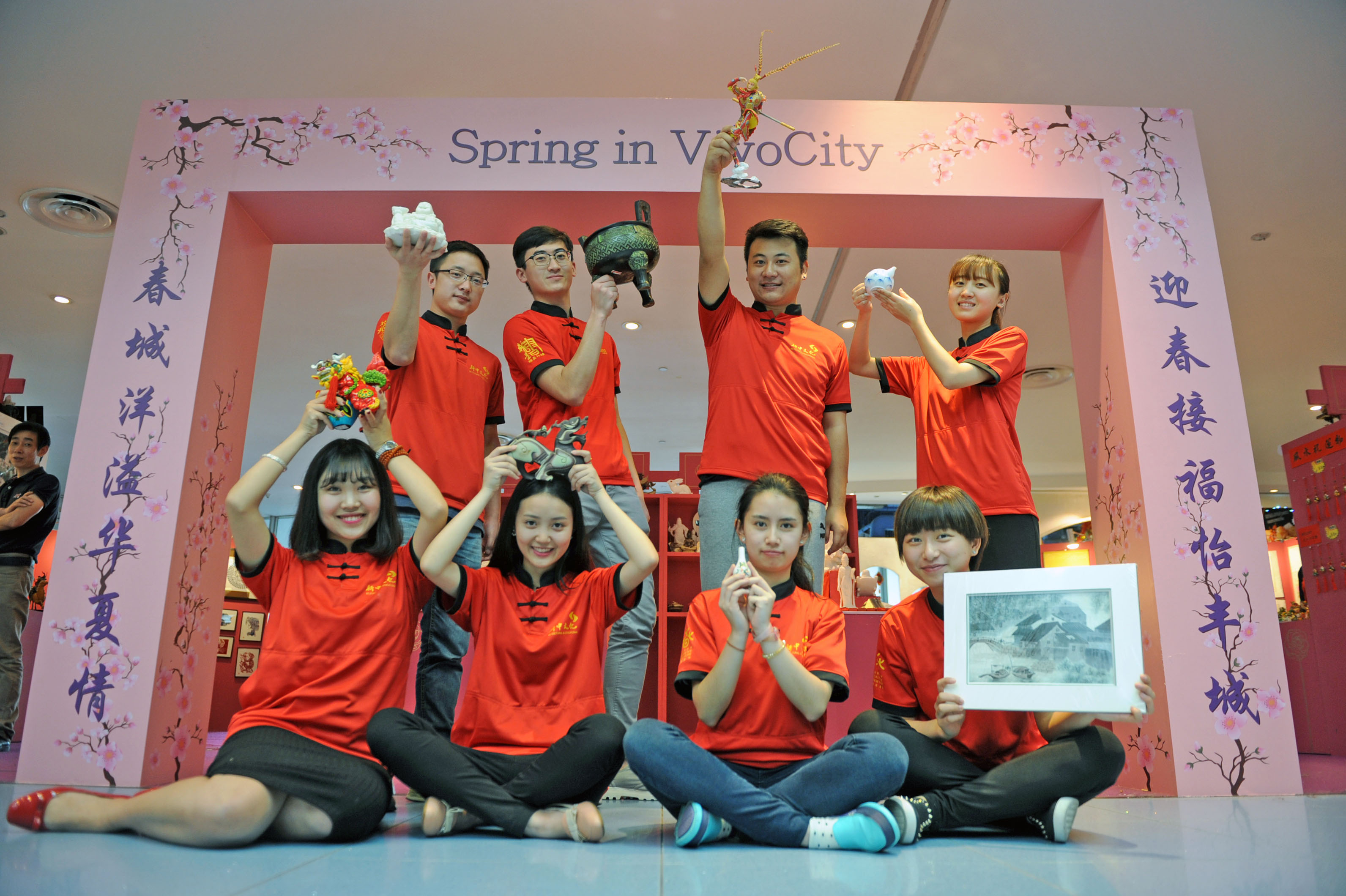 Among those manning the booths at VivoCity showcasing Chinese arts and culture are interns (seated from left) Jiang Yuzhu, Li Xiran, Dai Ling Rui Sha and Wei Lulu as well as (standing from left) Teng Xinjun, Zhang Tianyu, Zhu Bo and Tu Yue.