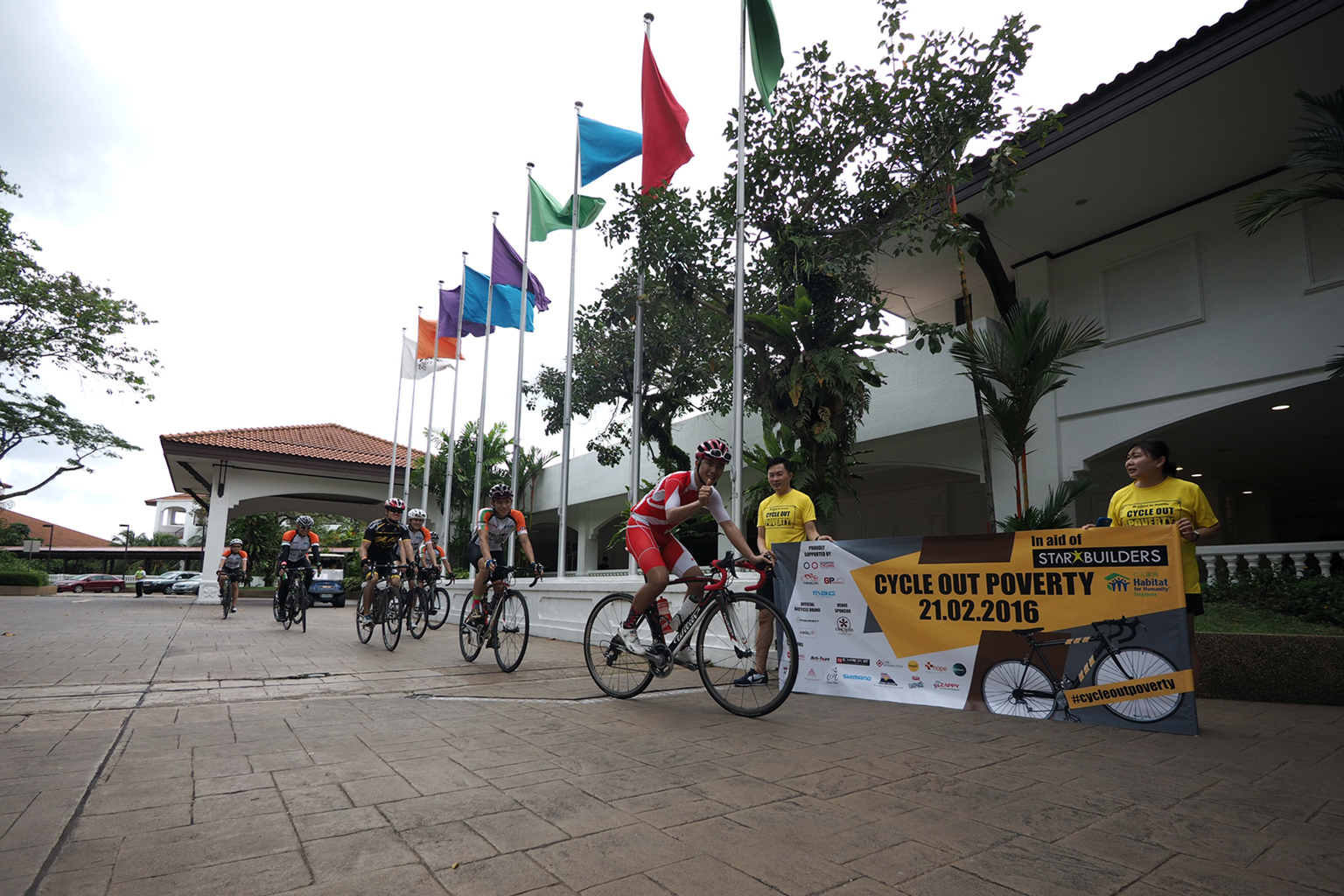 National cyclist Benedict Lee (front) was among 330 people who put their shoulders to the wheel at yesterday's Cycle Out Poverty event to raise funds for the StarBuilders programme. Disadvantaged youth taking part in the scheme are sent to developing