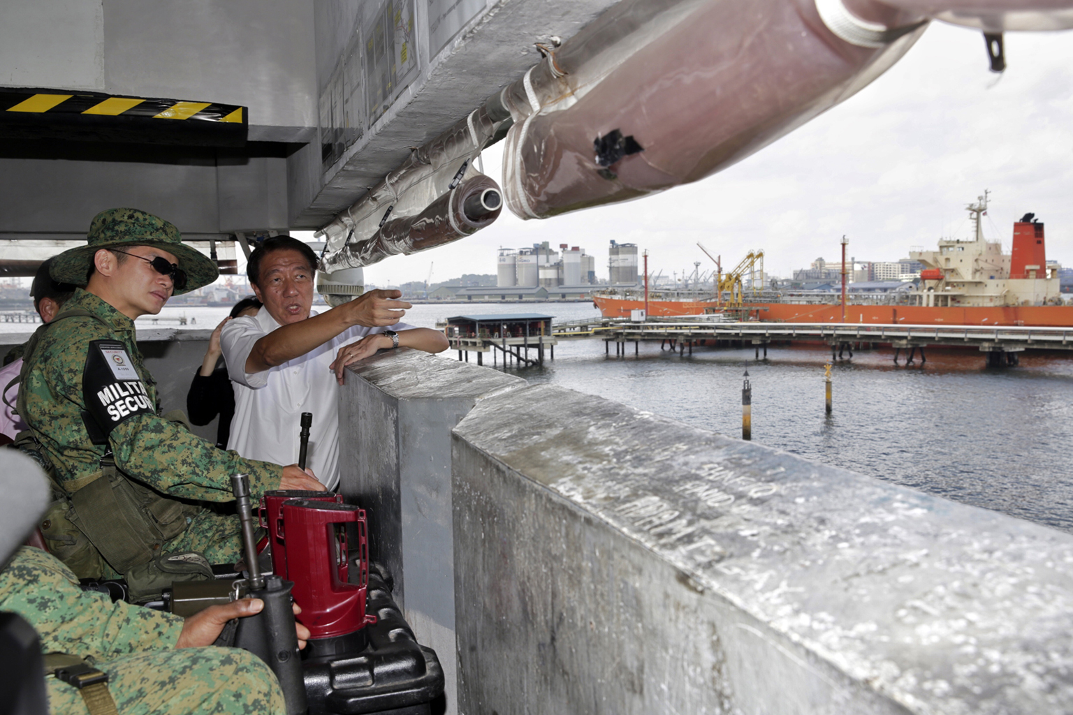 DPM Teo Chee Hean and Third Sergeant Chia Yong Guan, a 38-year-old security trooper, at an observation tower on Jurong Island yesterday. Mr Teo was visiting citizen soldiers deployed to patrol Jurong Island, the main location for the country's petroc