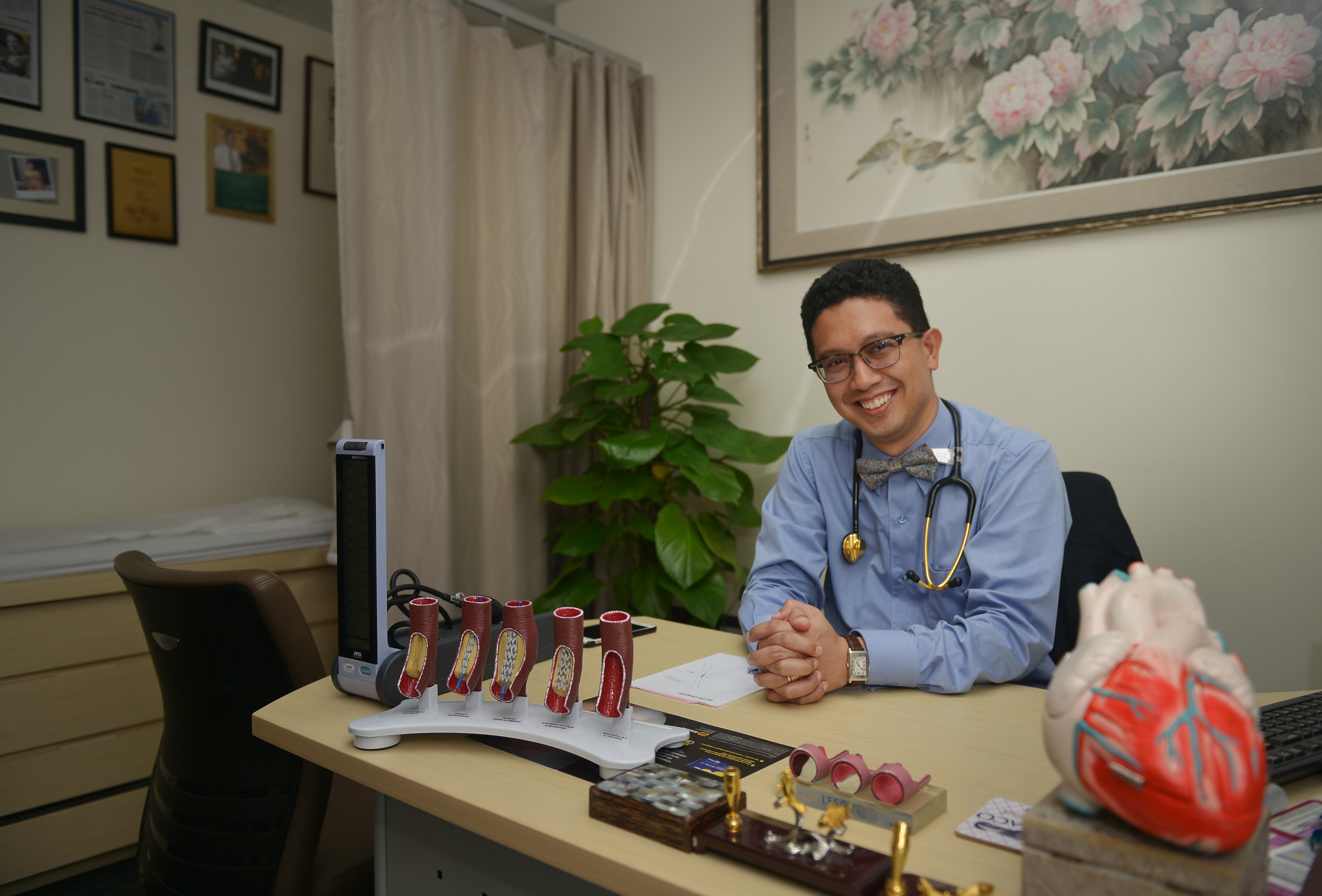 Cardiologist Abdul Razakjr Omar, seen here in his Raffles Hospital office, says common advice to prevent a heart attack like eating healthily, staying trim and exercising regularly may sound passe to some, but it works for many people.
