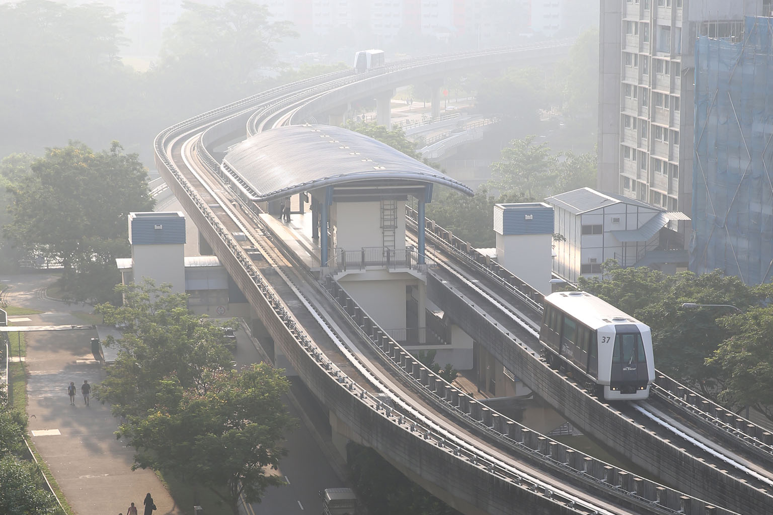 The skyline shrouded in haze in Sengkang West yesterday morning. There has been a strong burning smell in many areas since Tuesday, and NEA says air quality is expected to remain in the moderate range today.
