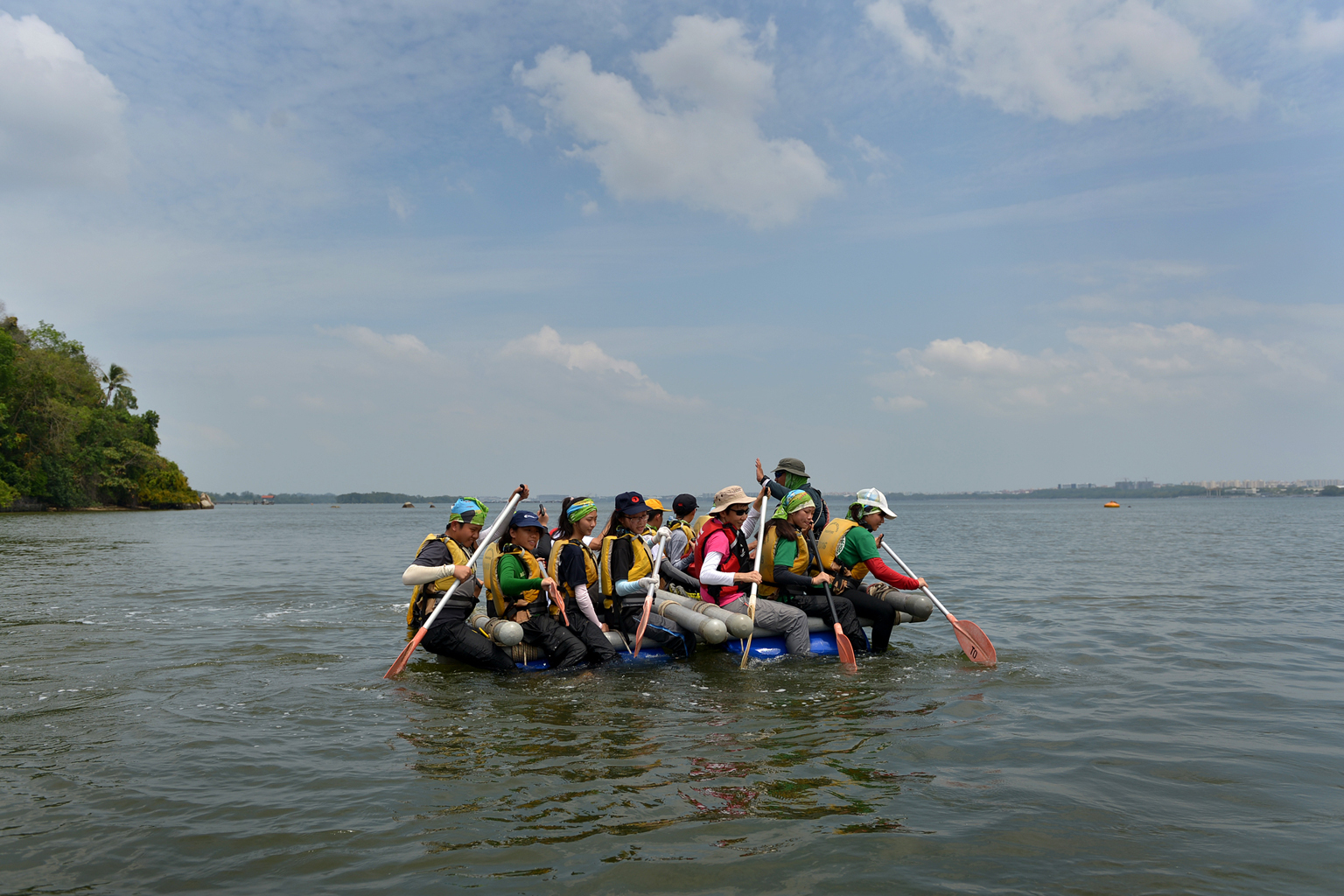 Minister Grace Fu (in pink) on a water raft that was constructed by OBS participants. Parents who spoke to ST said they were mainly supportive of making OBS compulsory as long as safety measures are adequate.