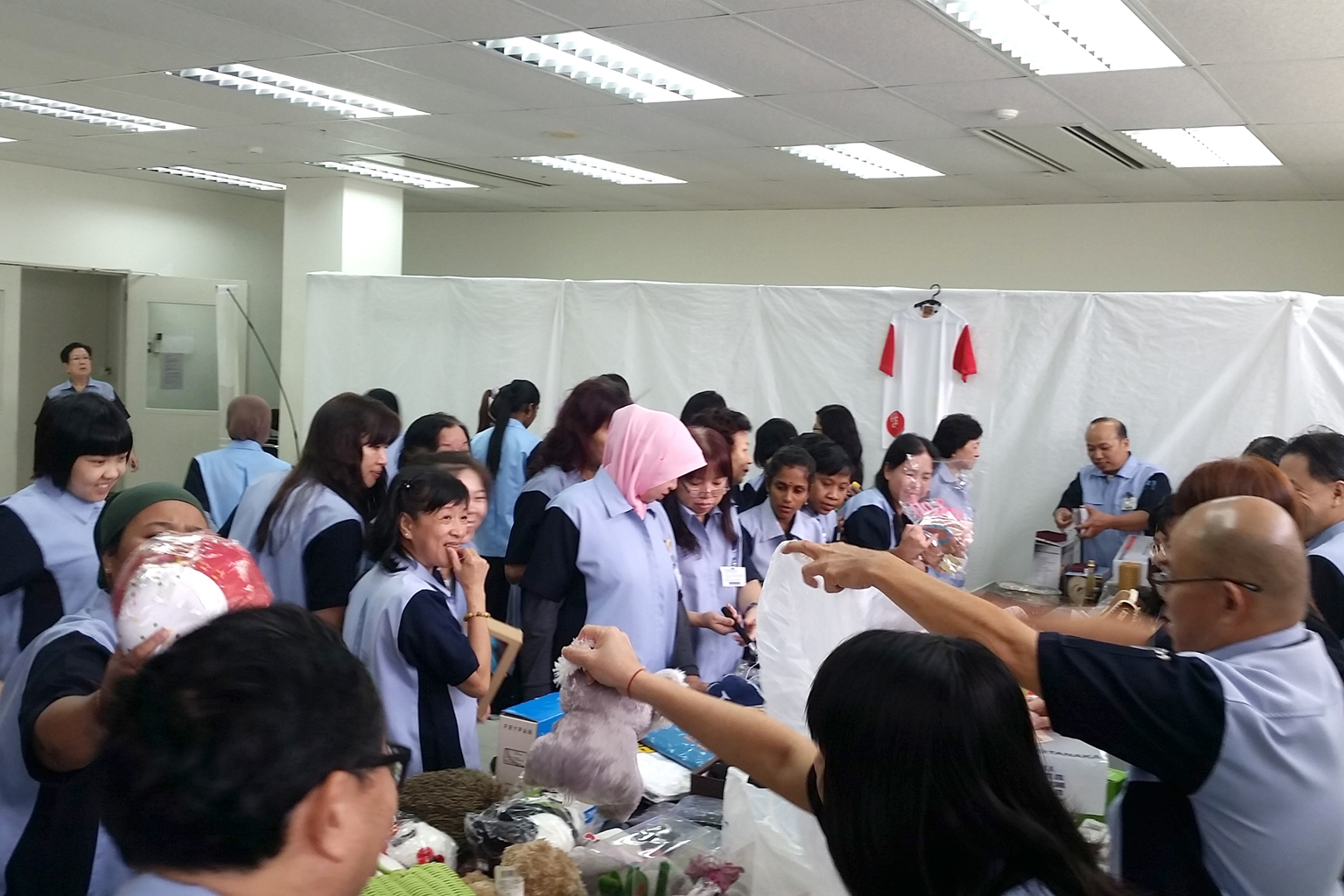 Tanaka Electronics staff at the flea market, which raised more than $5,300 for The Straits Times School Pocket Money Fund.