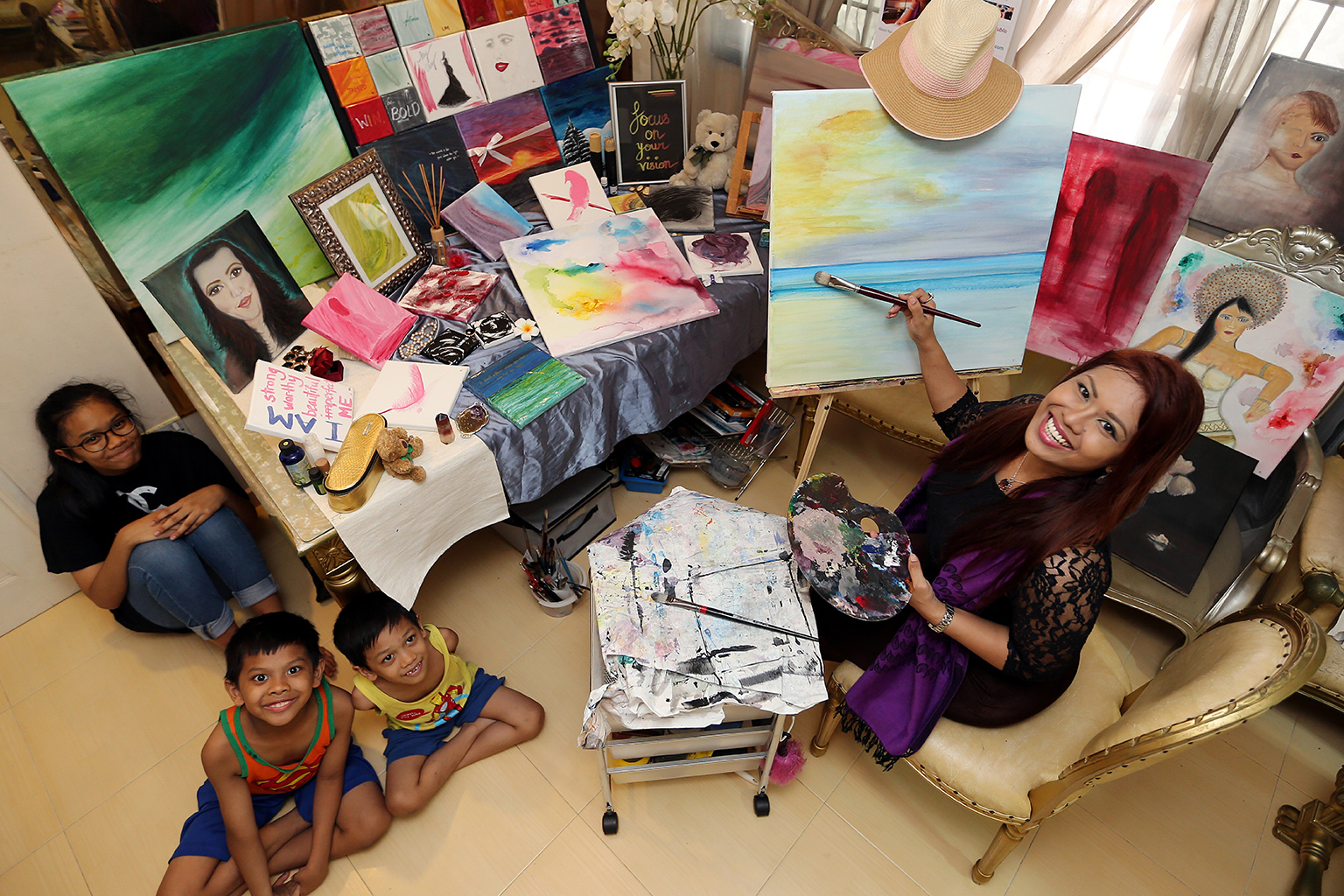 Ms Noor Naserimah with daughter Nina and sons Adam (in orange top) and Aiman. Life is too short for indulging in anything negative, says Ms Noor Naserimah, whose last epileptic seizure occurred a month ago.