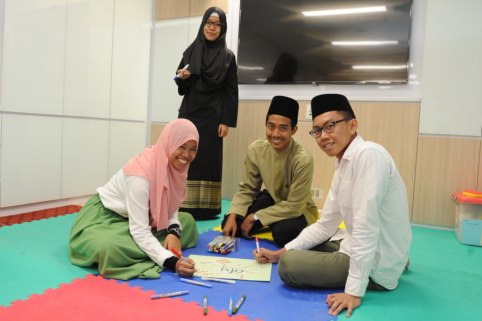 (From left) Ms Nur Zhafeerah Kamal and Ms Filzah Hanani Rahmad with youth development officer Muhammad Shahrum Sahid and youth exco member Wan Luqman Al-Hakim Dzulkarnain in the Al-Falah Mosque's new youth room.